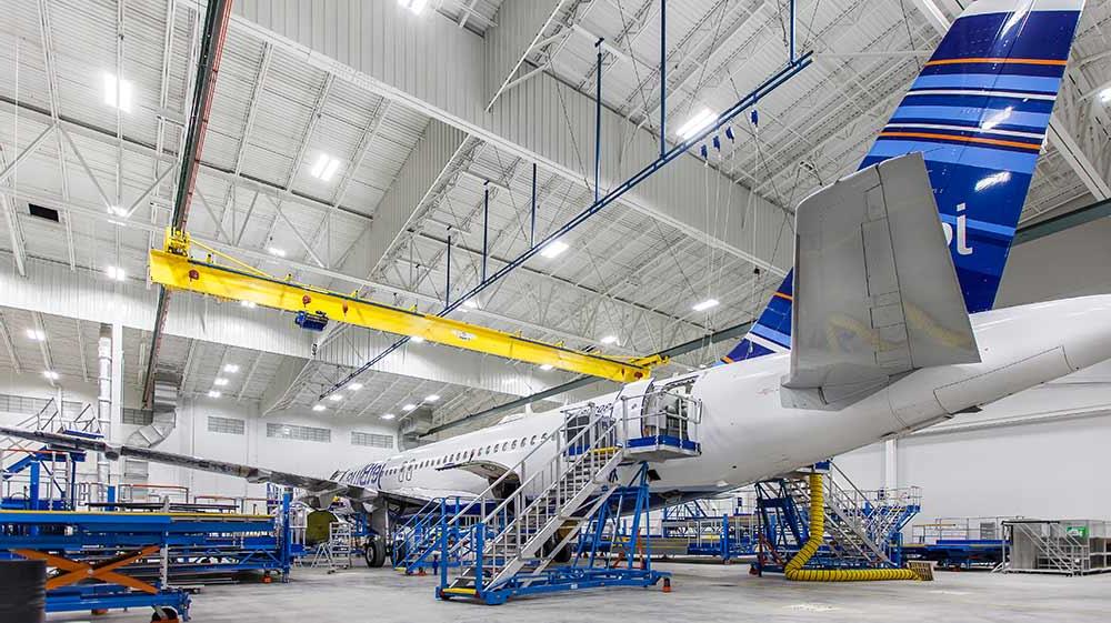 Airplane sitting inside Lufthansa Technik Heavy Maintenance Facility.